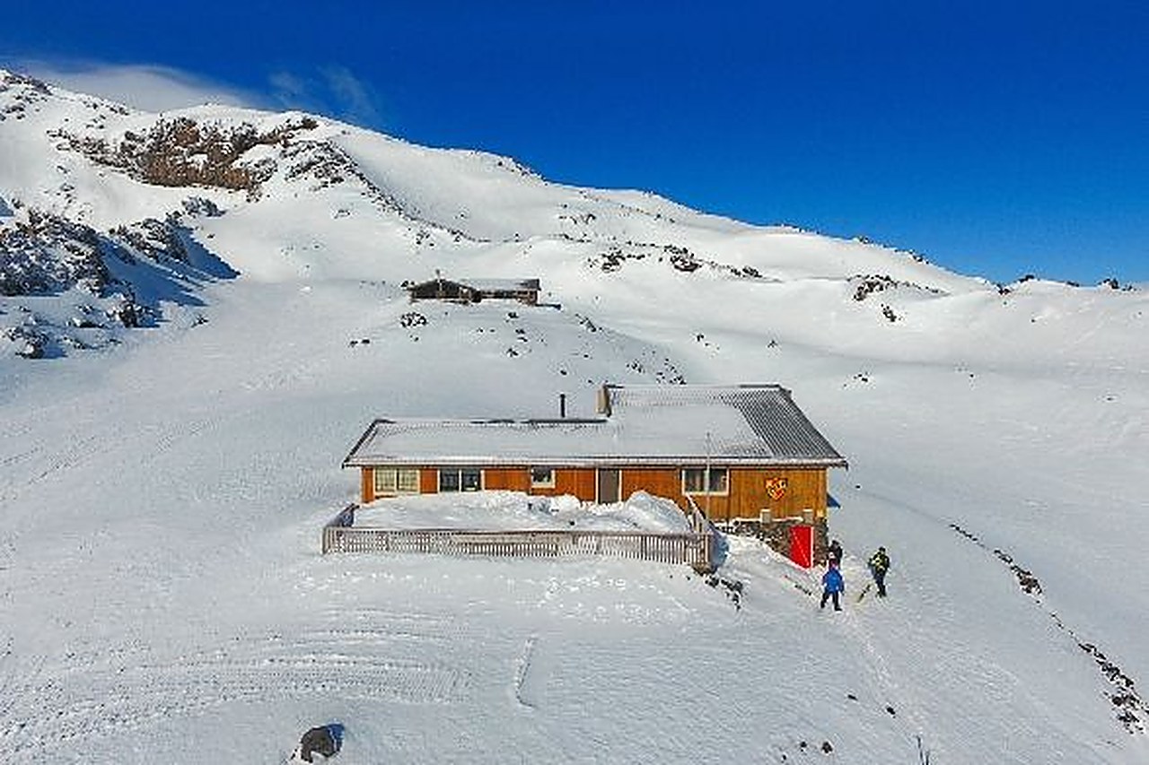 The Hut, a timber bunkhouse on the snow-covered Whakapapa skifield